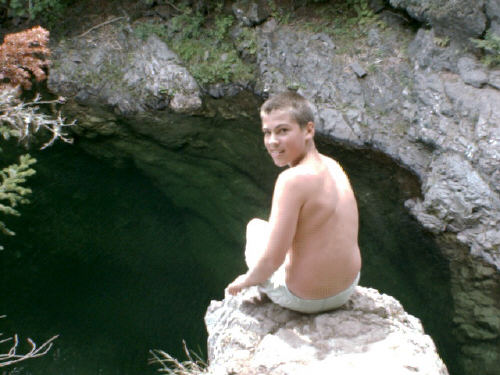 Boy Above Waterfall